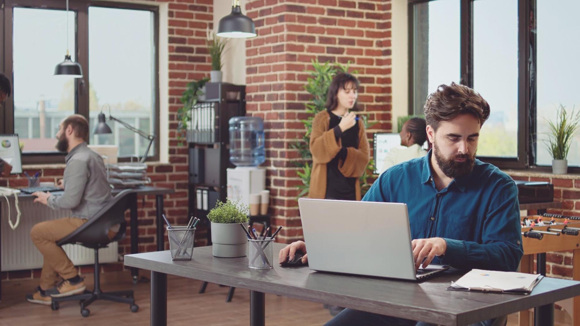 Financial analysis workspace with multiple monitors displaying market data and investment indicators